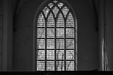 Black and white picture of an ornate cathedral window.
