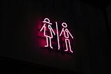 Neon stick figures of man and woman