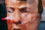 A weird-looking dummy head of Donald Trump.