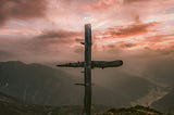 picture of a rugged cross on a hill
