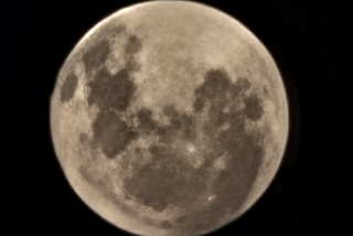photo of a full moon against a dark sky