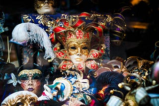 People in colorful mask and costume at Carnival.