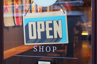 An “open” sign on a shop’s door