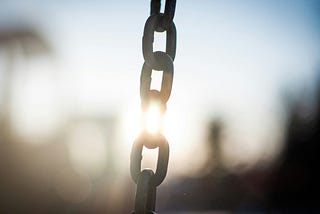 Light shining through a chain