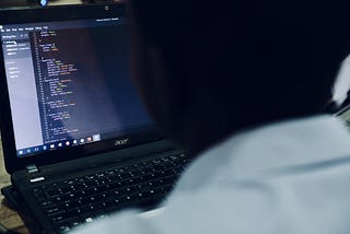 A guy coding in laptop