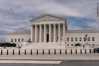 A view of the Supreme Court of the United States from across the street.