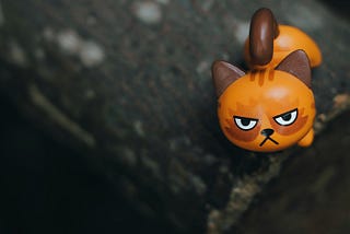 A toy cat with an angry face