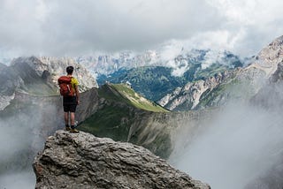 Man standing on rock looking at beautiful mountains — Photo by Lucas Clara on Unsplash