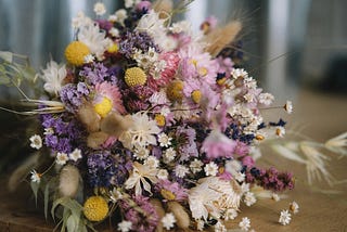 A dried bouquet lying on a table.