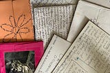 Envelopes of letters from the author’s friend Ella covered with Ella’s handwritten notes.