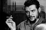 Ernesto “Che” Guevara enjoying a Cuban cigar.