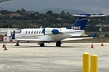 A private jet parked near a runway