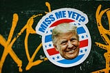 Donald Trump is pictured on a red, white, and blue sticker with the phrase, “Miss Me Yet?” above him.