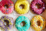 Multicolored Doughnuts on White Textile. How to reduce your sugar cravings. How to become a moderate sugar consumer. How I’ve managed to control my sugar cravings since I completed my 30-day no-sugar challenge