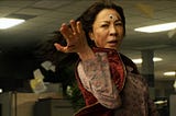 Still of Michelle Yeoh as Evelyn Wang in 2022’s Everything Everywhere All At Once, creating a tailspin in the IRS office