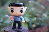 A picture of a spock figurine giving the “live long and prosper” sign