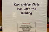 A photo of the cover of a three-ring binder titled “Karl and/or Chris Has Left the Building.”