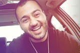 Imprisoned Iranian rapper Toomaj Salehi Smiles at the camera