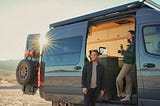Mercedes Sprinter 4x4 campervan with man and woman drinking tea