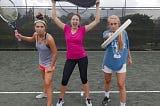 Three Women Holding Tennis Rackets