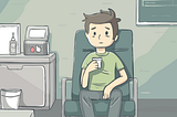 Man with an exasperated expression holding a sample cup while sitting on a wide char in a examination room.