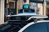 IMAGE: A Waymo Jaguar iPACE vehicle’s top, with its gyrating lidar, several cameras and sensors