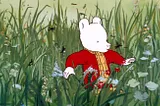 A still from “Rupert and the Frog Song”, showing Rupert trekking through a field.