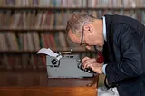 David Sedaris at a typewriter