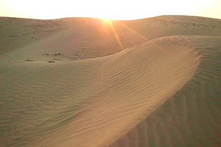 Sunrise on dunes.