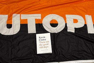 The book on a big flag that says LUTOPIA