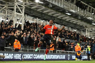 Teden Mengi jumps for joy in fornt of the Bobbers stand celebrating his goal against Paalce