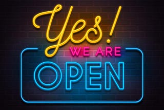 An illustration that looks somewhat like a neon sign that reads “Yes! WE ARE OPEN.”