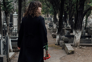 woman standing in cemetery