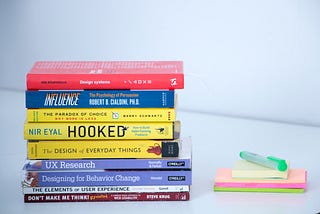 a stack of design books, with “design systems” on top
