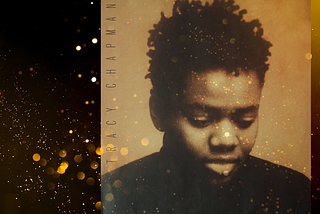 Image of Tracy Chapman on her 1988 cover album, black female with short hair and black shirt, looking down with text of Tracy Chapman on the side bar with gold dust and dots scattered accross the image.