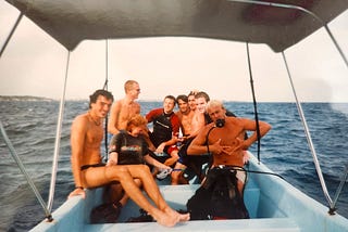 A group of divers, including Gentry Bronson, on a dive boat off the coast of the island of Utila, Honduras