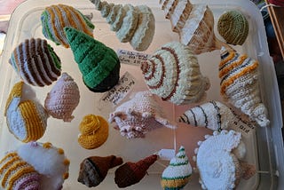 Close up views of knitted and crocheted Seashells.
