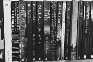 The books of Paul Auster on a shelf