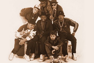 Press photo of the rap groups, Run DMC and the Beastie Boys.