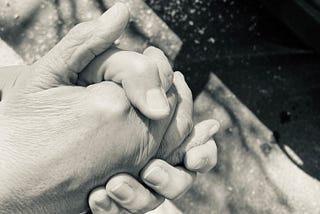 Black and white image of Mom and I holding hands