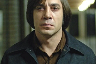 The One Factor that Makes Anton Chigurh the Scariest Hitman in Movie History