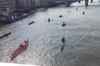Several boats rowing on the river
