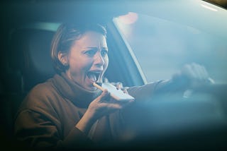 woman in car screaming on cell phone