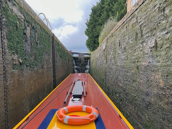 Photo by Author — onboard a narrowboat on a lock on the Oxford Canal