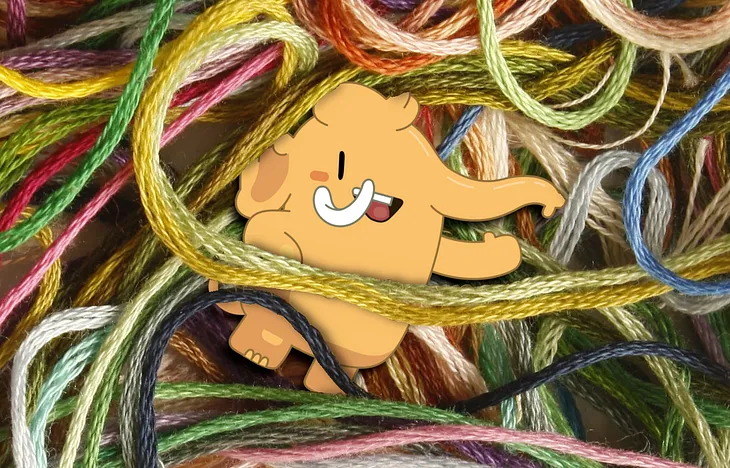 The mastodon mascot tangled in a snarl of thread.