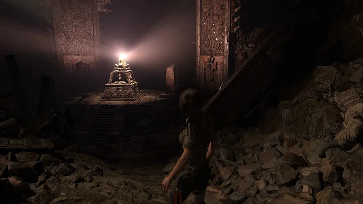 Lara Croft approaches a shiny gem she probably shouldn’t touch in Shadow of the Tomb Raider.