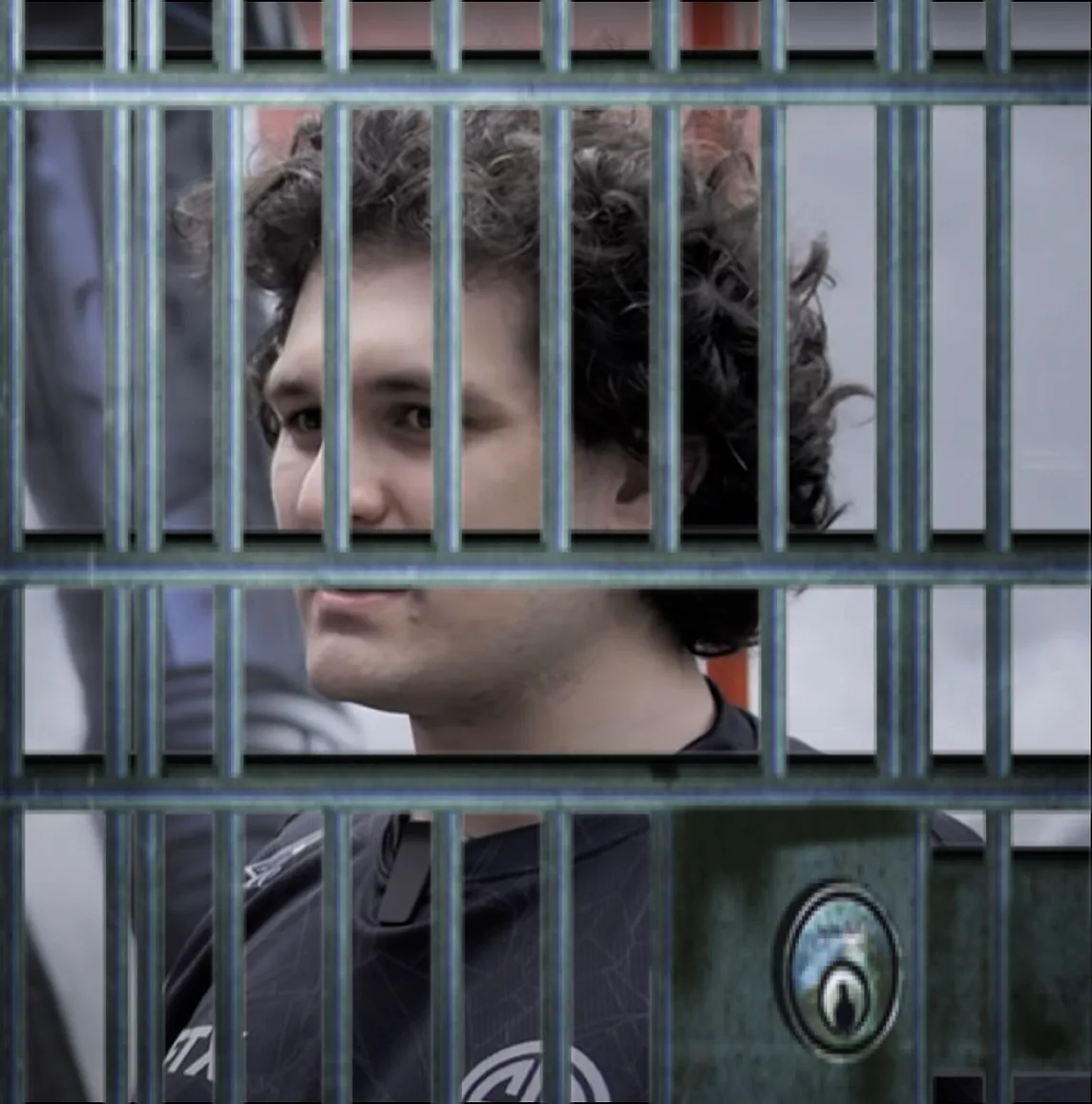 IMAGE: An image of Sam Bankman-Fried with a set of prison bars pasted over it