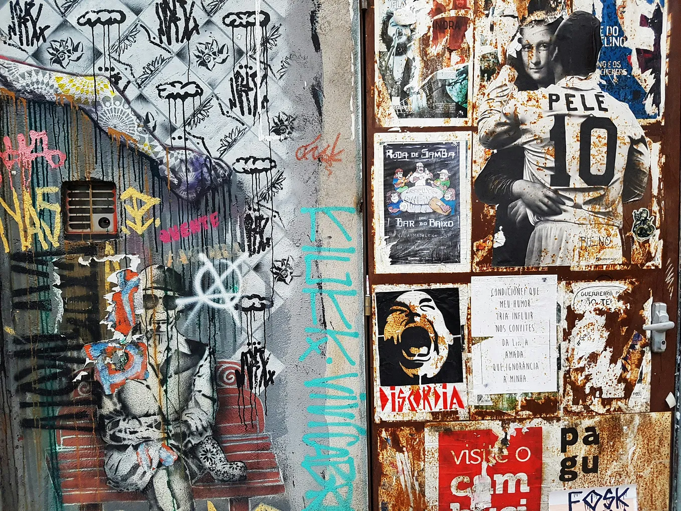 Photo of a wall outside that is covered with stickers and political posters with punk themes by Mínimo on Unsplash