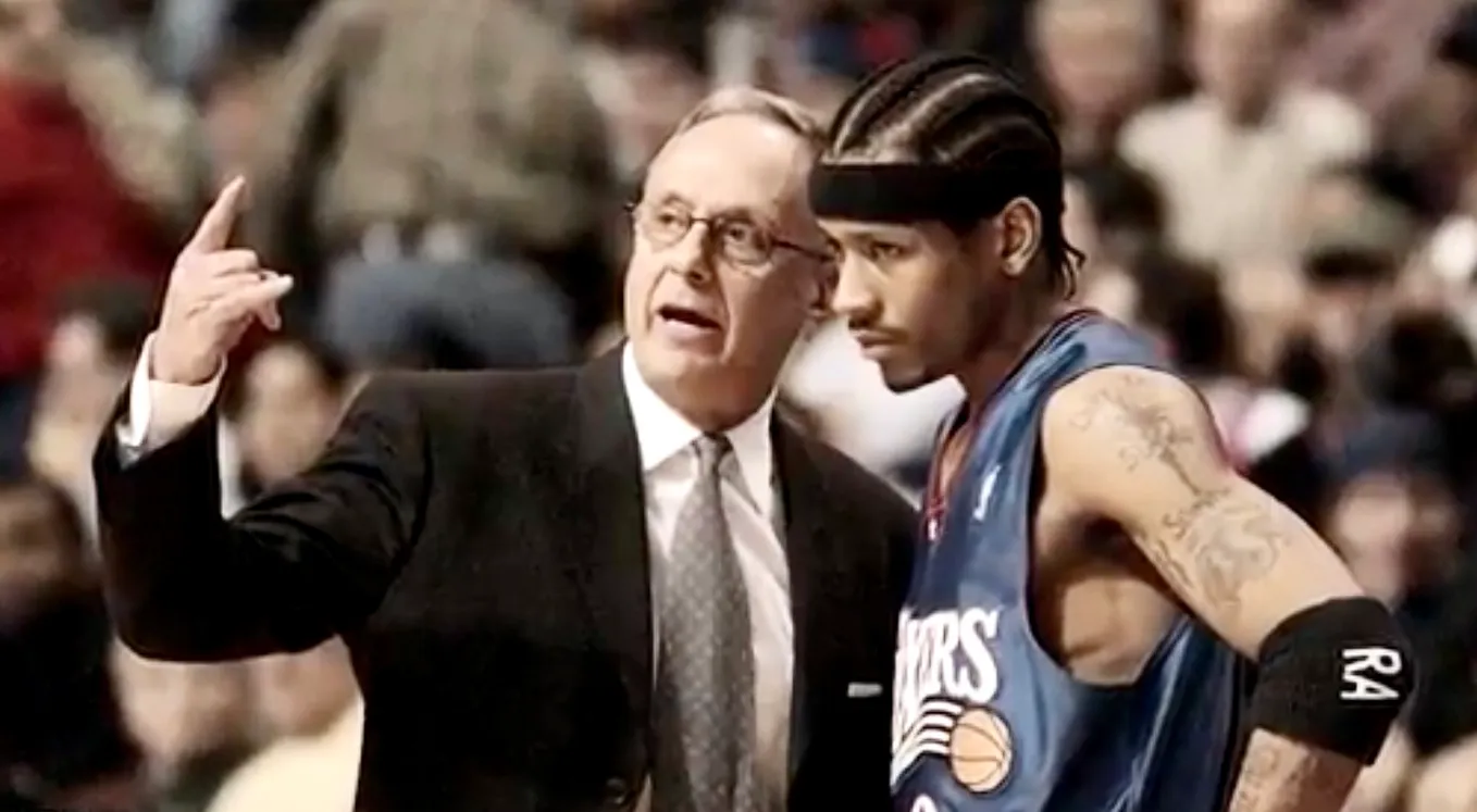 Coach Larry Brown talking to Allen Iverson on the sidelines.